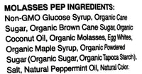 A close-up of a product ingredients label reading 'MOLASSES PEP INGREDIENTS:' followed by a list of ingredients including glucose syrup, cane sugar, brown cane sugar, coconut oil, organic molasses, egg whites, maple syrup, powdered sugar, salt, and peppermint oil.