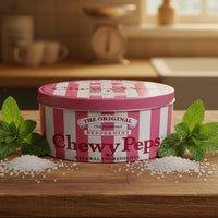A round metal tin of The Original Chewy Peps candy, featuring a red and white striped design with the brand name printed in red on the front and lid.